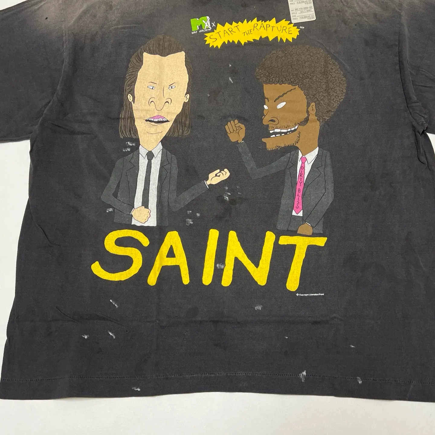 SAINT Mxxxxxx RAPTURE SS TEE/BLK Beavis and Butt-Head anime character TEE. Washed black S-XL. The print is from the characters of the American classic animation "Beavis and Butt-Head". It also pays tribute to the two classic killer characters in "Pulp Fiction". It is very witty and humorous. The whole garment is washed again.